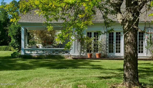 a front view of house with yard and green space
