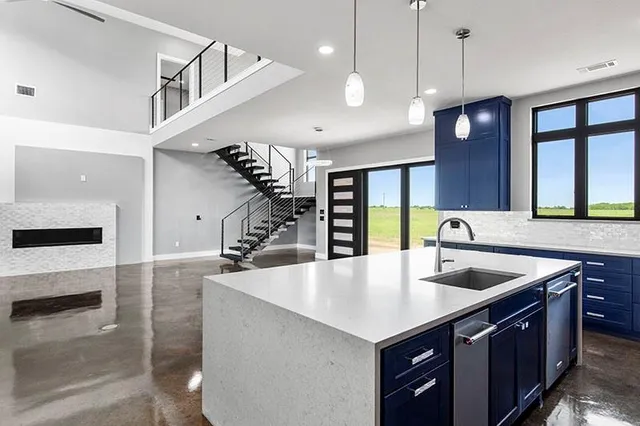 a kitchen with a sink and wooden cabinets