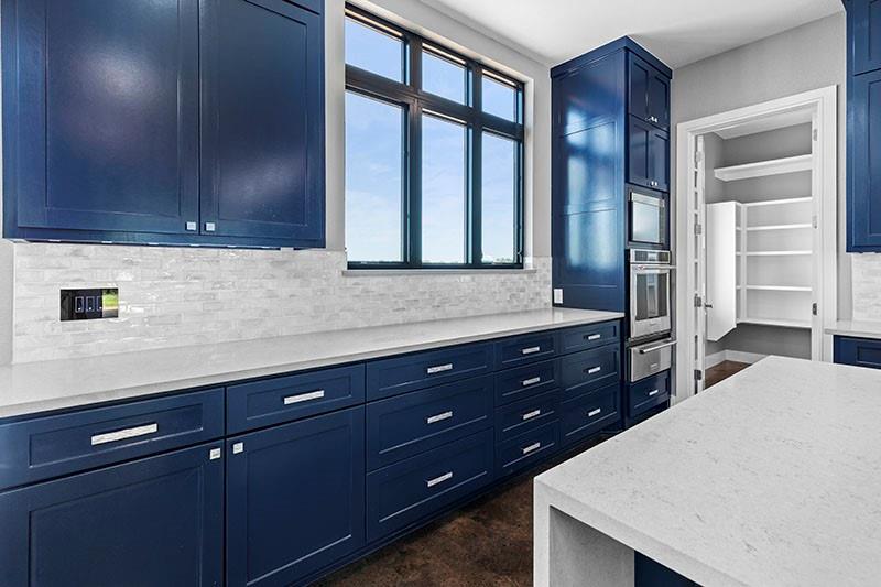 186 Martin Lane Sadler, TX 76264 - Photo 14 of 39 a kitchen with a sink and wooden cabinets