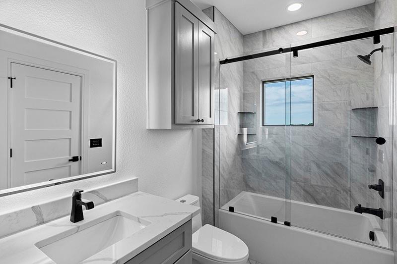 186 Martin Lane Sadler, TX 76264 - Photo 26 of 39 a bathroom with a sink and a mirror