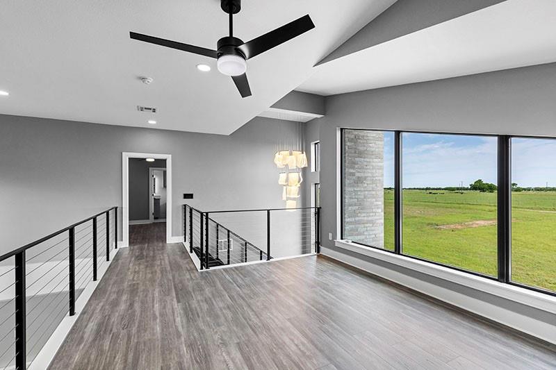 186 Martin Lane Sadler, TX 76264 - Photo 28 of 39 a view of room with window and wooden floor
