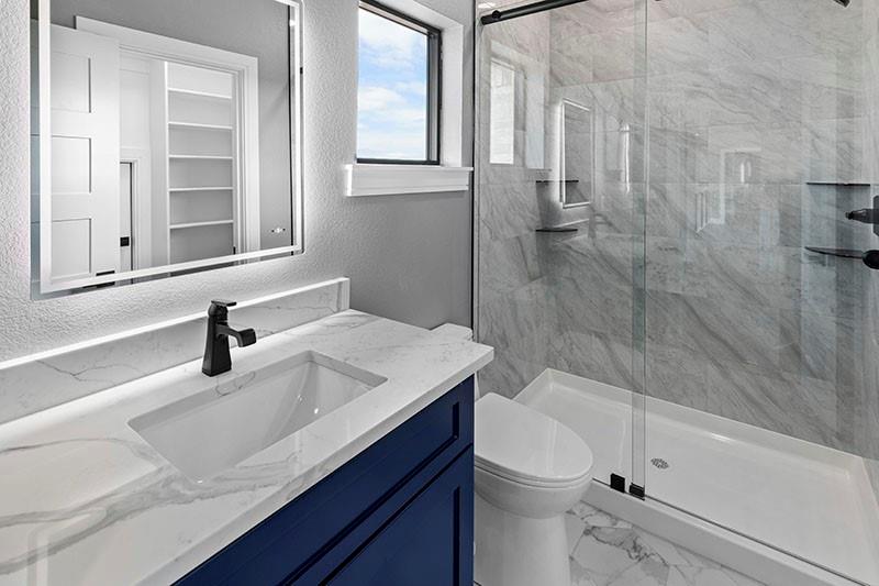 186 Martin Lane Sadler, TX 76264 - Photo 29 of 39 a bathroom with a sink a toilet and shower