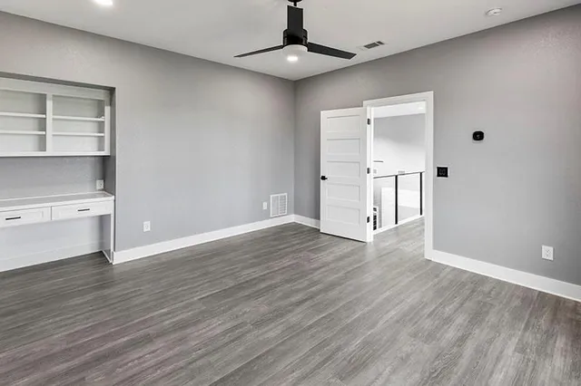 a view of an entryway with wooden floor