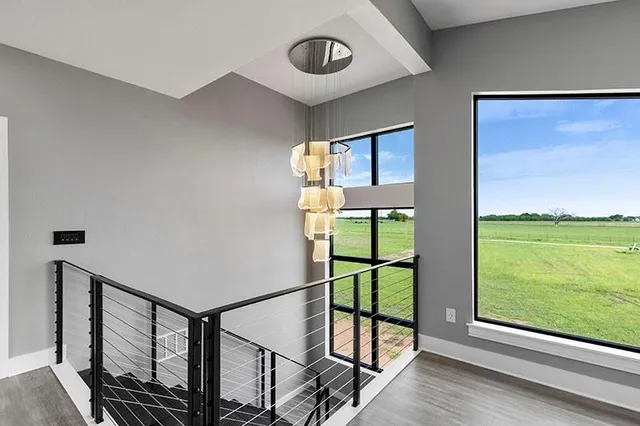 front view of a brick house with a large window