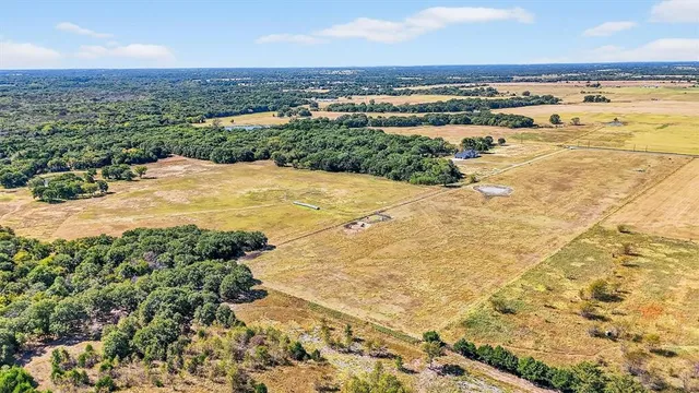 a view of a swimming pool with a yard