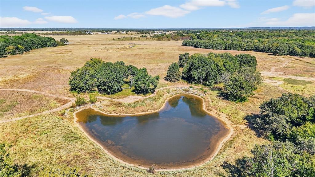 186 Martin Lane Sadler, TX 76264 - Photo 9 of 39 a view of a swimming pool with a yard