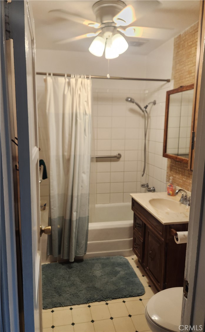 13754 Weidner Street Pacoima, CA 91331 - Photo 12 of 16 a bathroom with a sink a toilet a mirror and shower