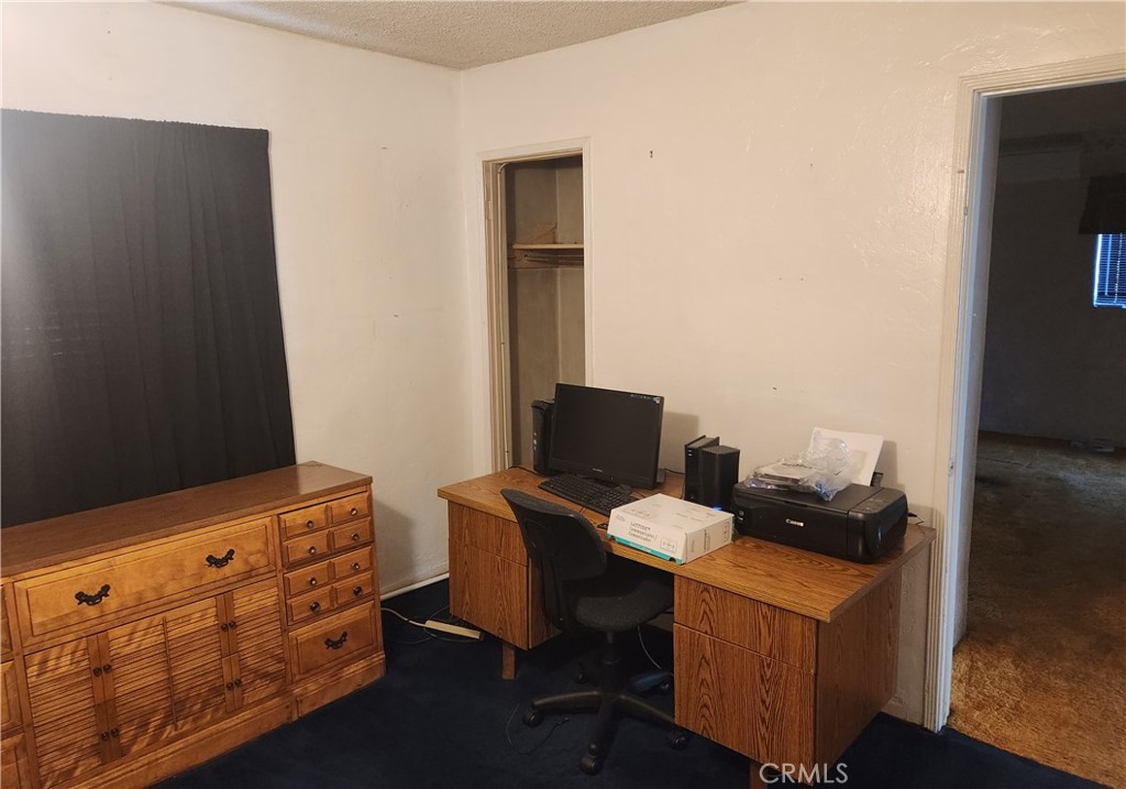 13754 Weidner Street Pacoima, CA 91331 - Photo 13 of 16 a work place with furniture and wooden floor