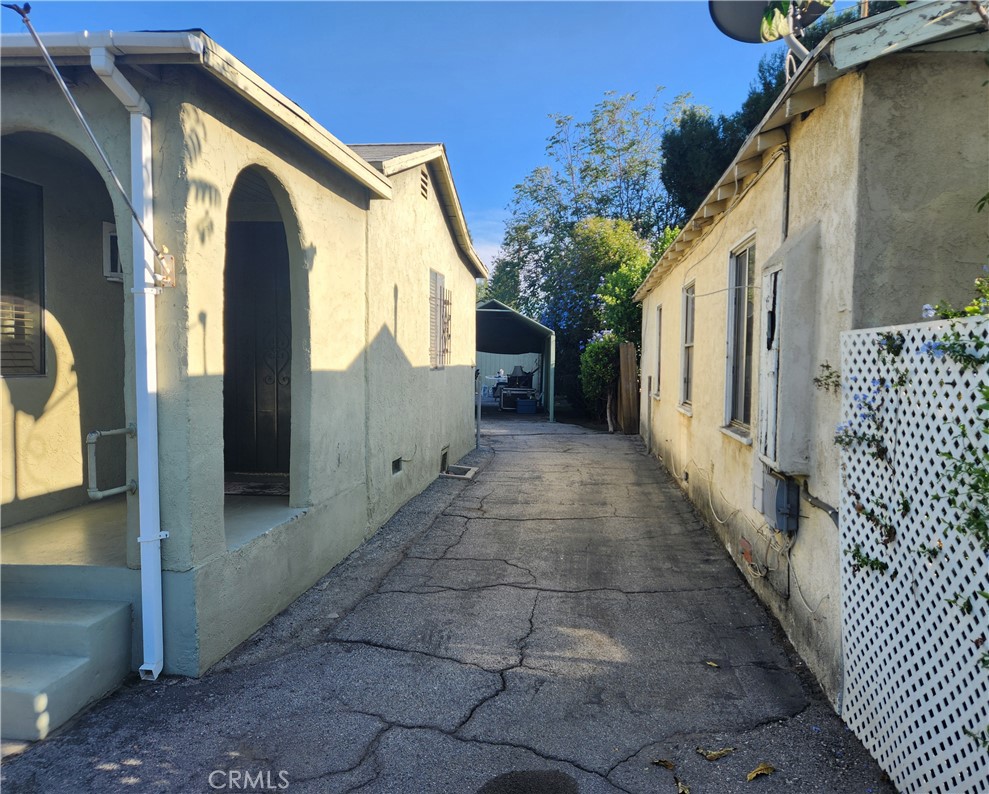 13754 Weidner Street Pacoima, CA 91331 - Photo 2 of 16 a view of a house with a backyard