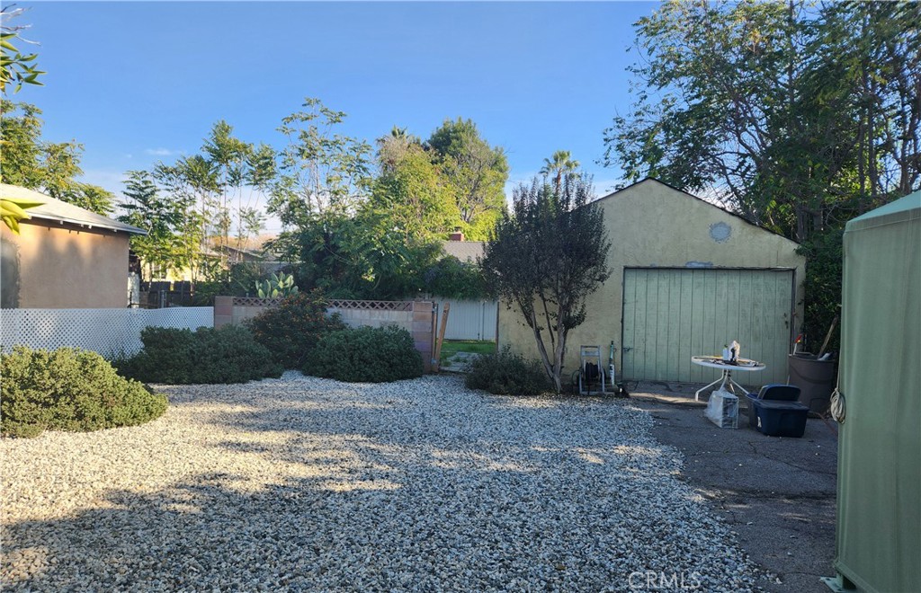 13754 Weidner Street Pacoima, CA 91331 - Photo 4 of 16 a view of a house with yard and a tree