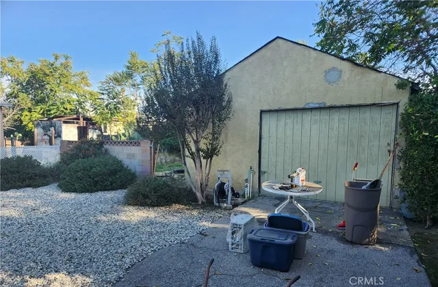 a view of a patio with table and chairs and a fire pit