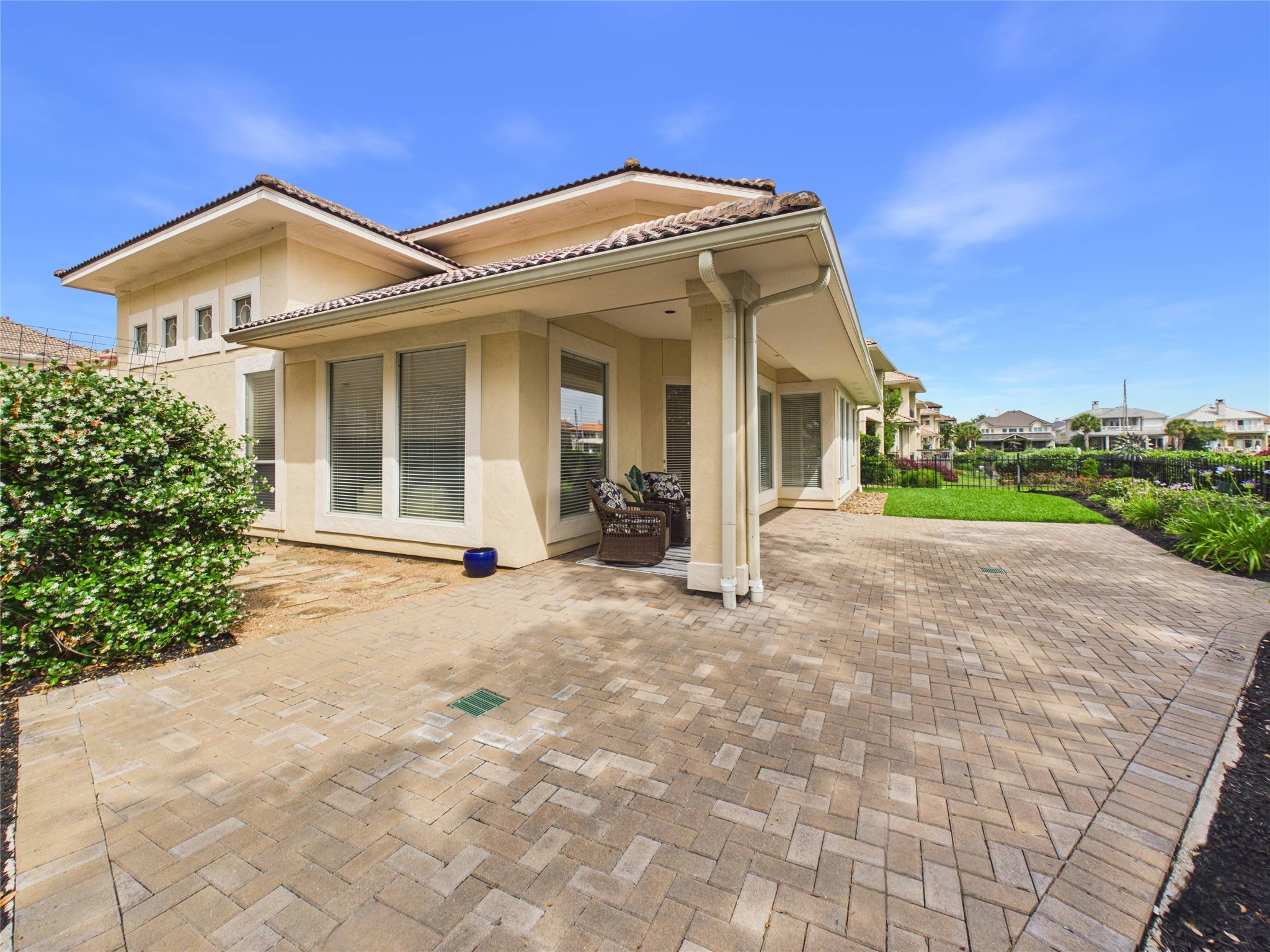 403 Harborside Way Kemah, TX 77565 - Photo 22 of 39 Well manicured yard has lawn area, views of marina and low maintenance paver patio