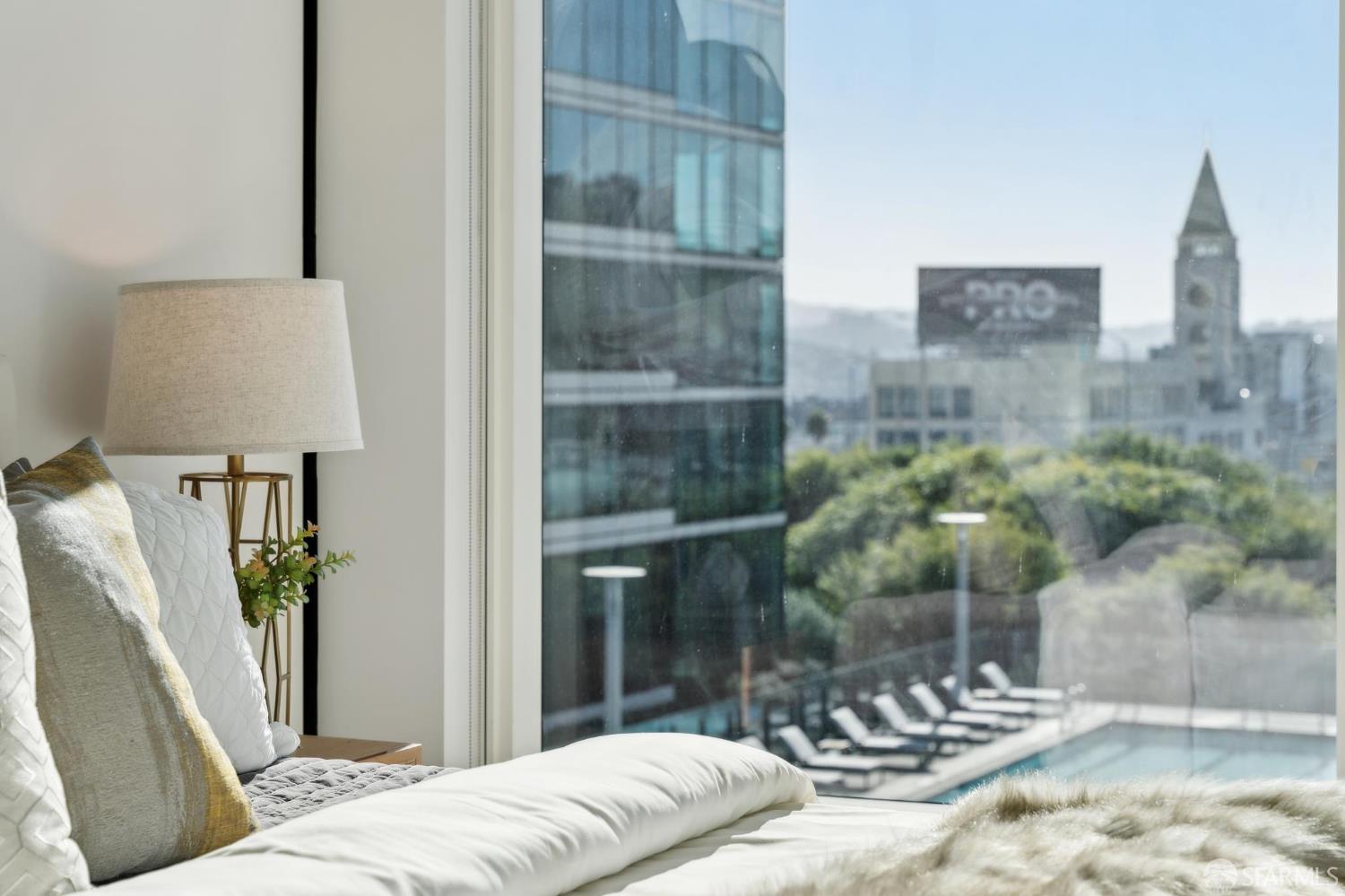 401 Harrison Street, Unit 9H San Francisco, CA 94105 - Photo 18 of 44 a bedroom with a bed and a window