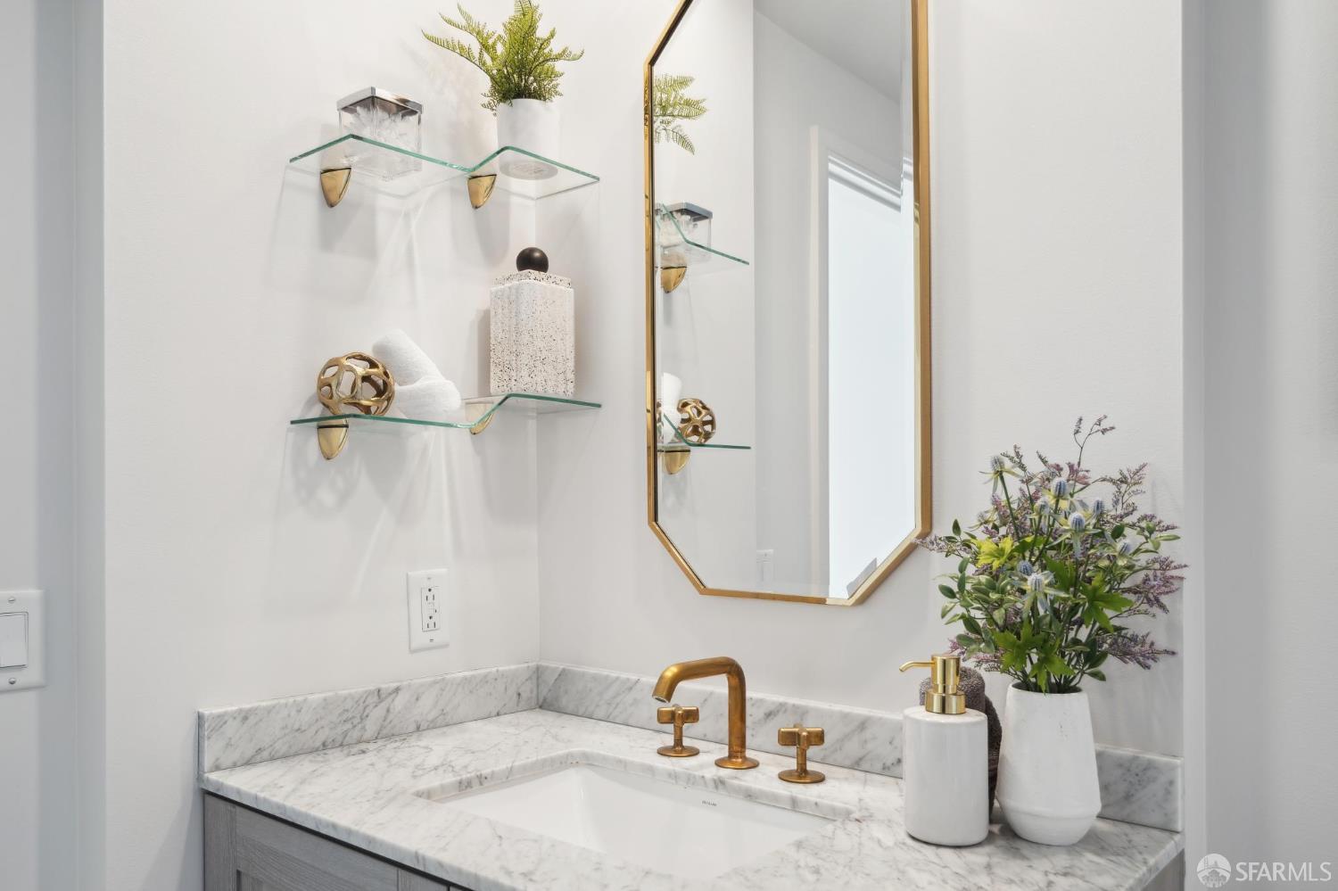 401 Harrison Street, Unit 9H San Francisco, CA 94105 - Photo 21 of 44 a bathroom with a granite countertop sink a mirror and shower