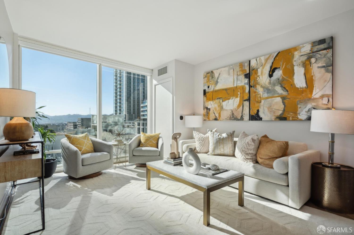 401 Harrison Street, Unit 9H San Francisco, CA 94105 - Photo 3 of 44 a living room with furniture and a lamp