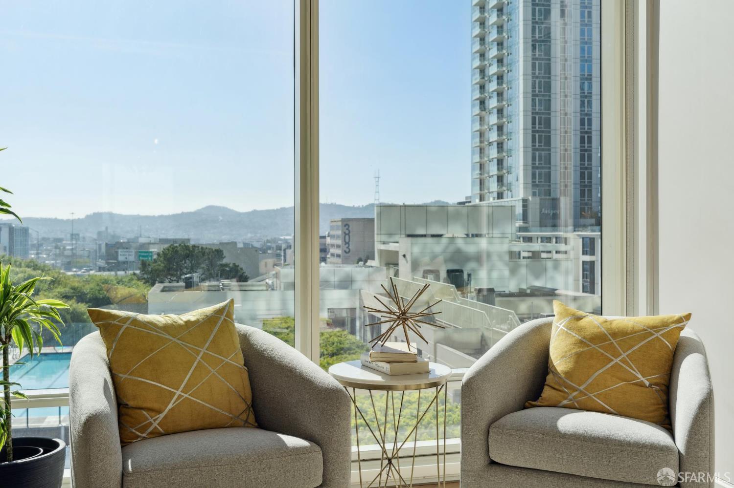 401 Harrison Street, Unit 9H San Francisco, CA 94105 - Photo 4 of 44 a view of a balcony with furniture and a potted plant