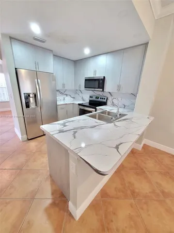 $485,000 | 8551 Northwest 141st Terrace, Unit 301, Miami Lakes, FL 33016