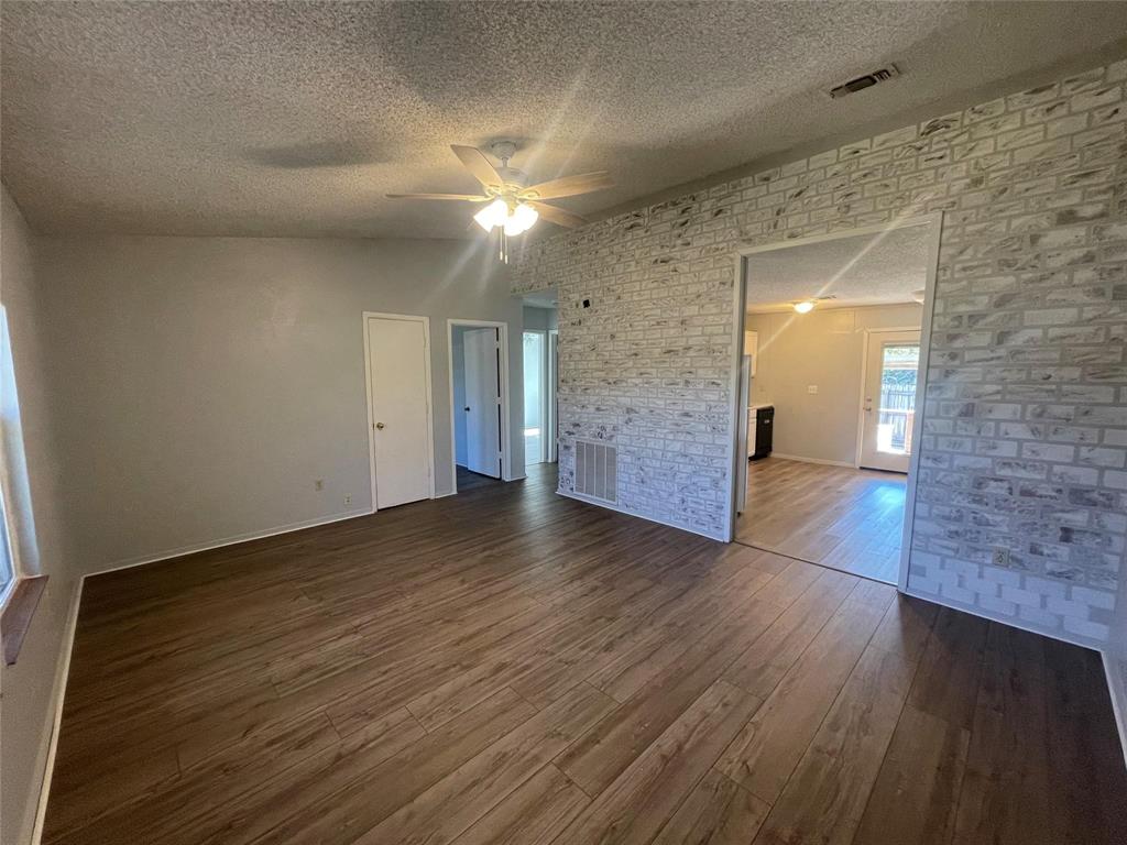4209 Quail Ridge Court Granbury, TX 76049 - Photo 2 of 8 a view of a hallway with wooden floor
