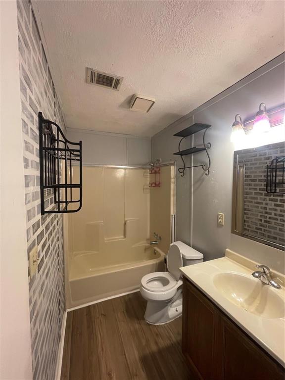 4209 Quail Ridge Court Granbury, TX 76049 - Photo 6 of 8 a bathroom with a sink a toilet and shower