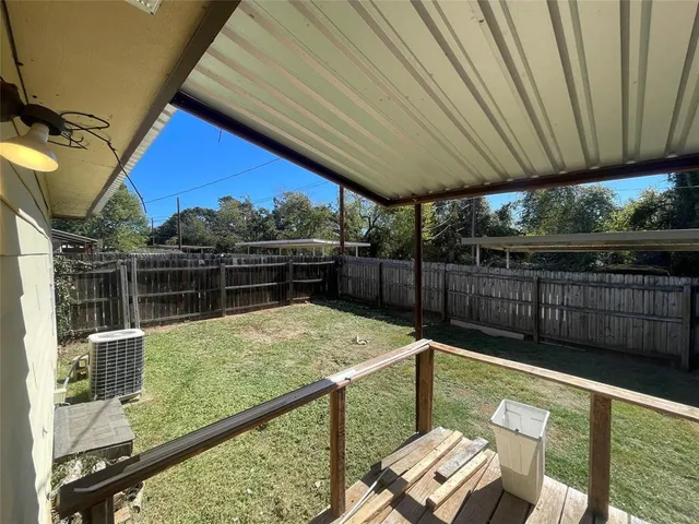 a view of a balcony with furniture