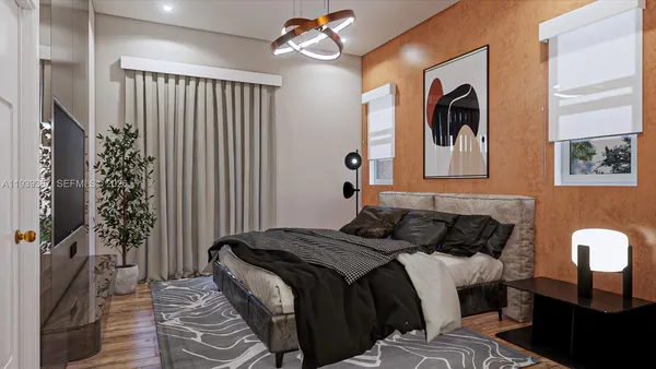 a kitchen with stainless steel appliances kitchen island granite countertop a stove a sink and white cabinets with wooden floor