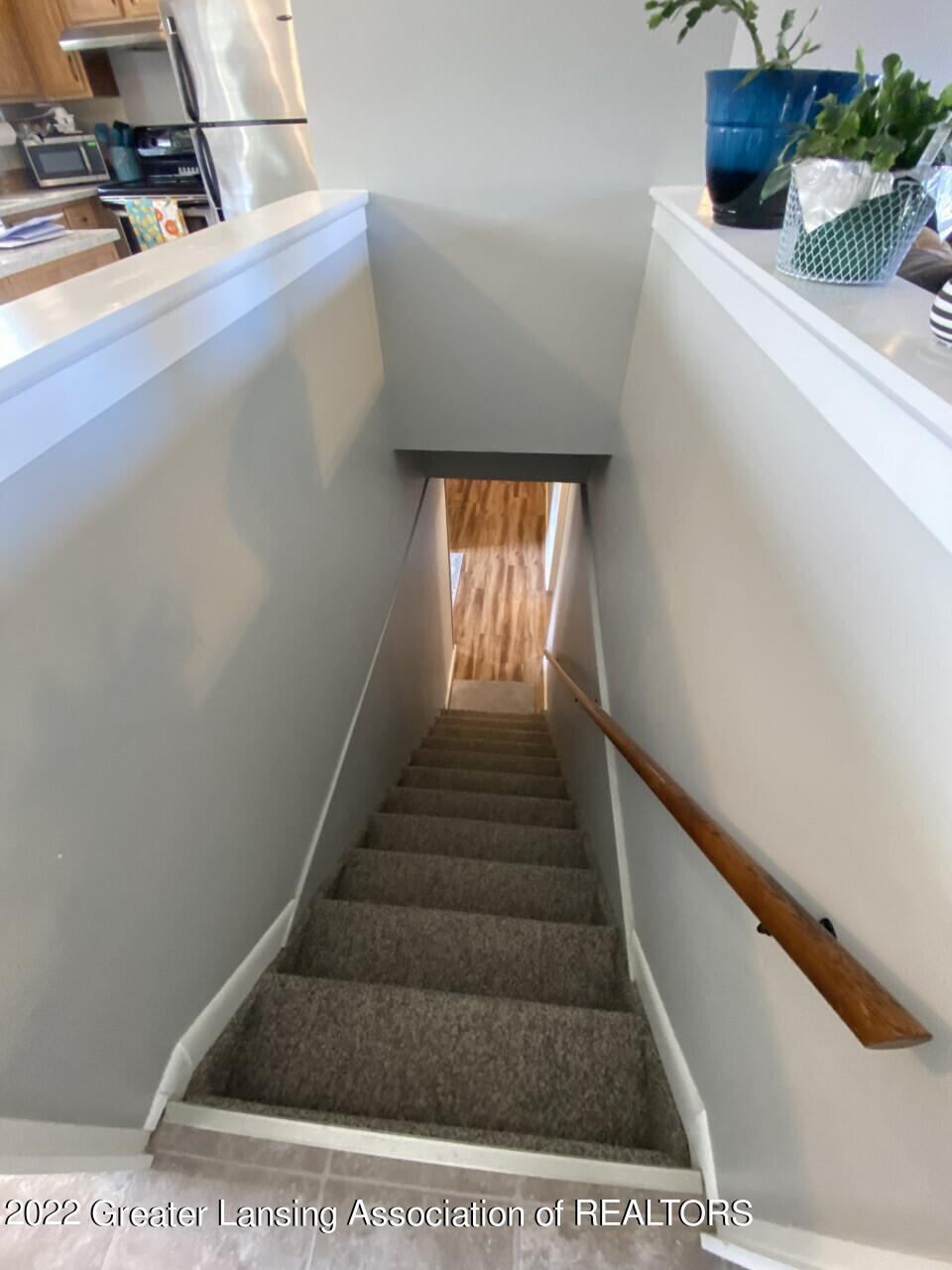 1100 Northcrest Road Lansing, MI 48906 - Photo 21 of 36 stairway to basement