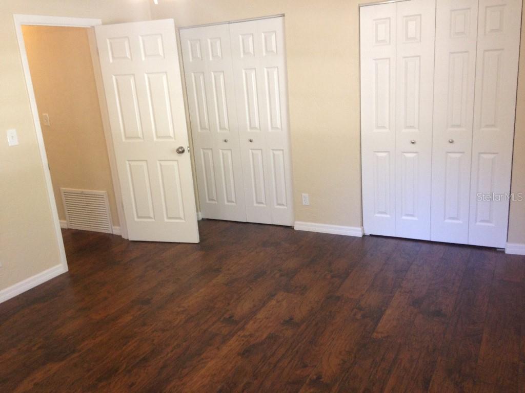 2829 Northwest 40th Place Gainesville, FL 32605 - Photo 3 of 15 an empty room with wooden floor