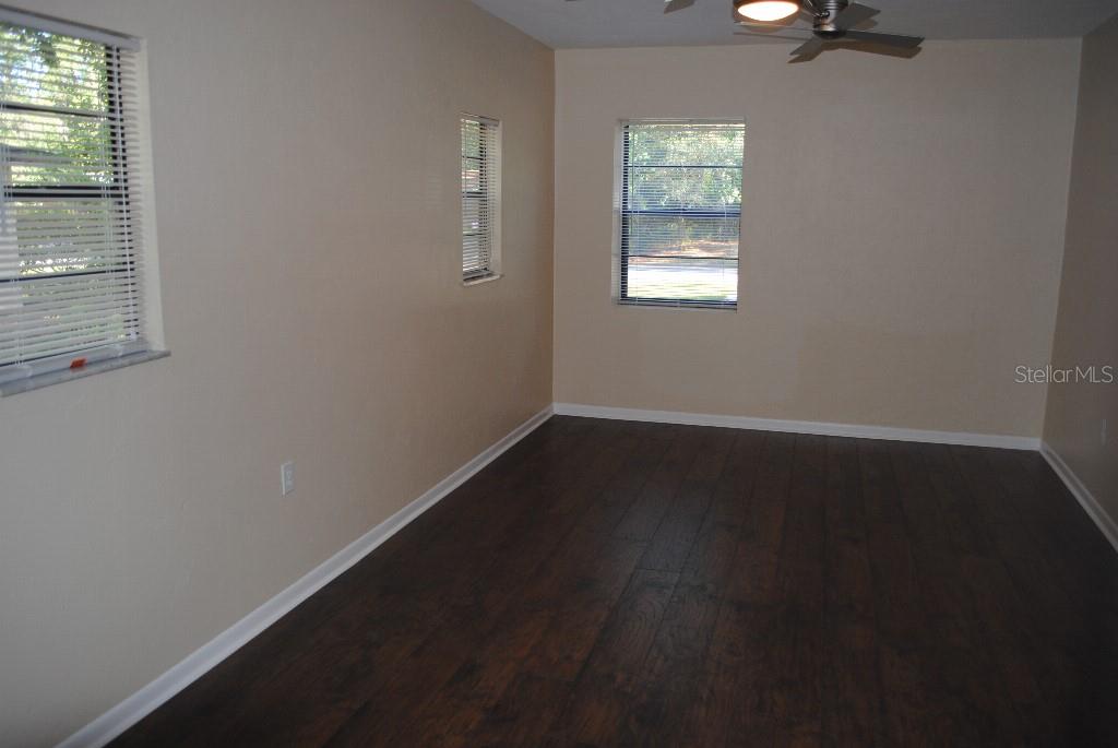 2829 Northwest 40th Place Gainesville, FL 32605 - Photo 7 of 15 an empty room with a window
