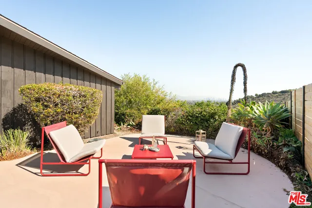 a view of backyard with seating space