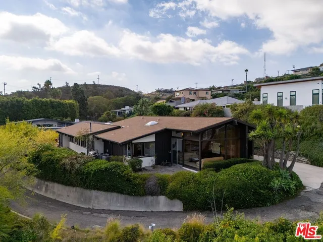 a view of house with river and outdoor space