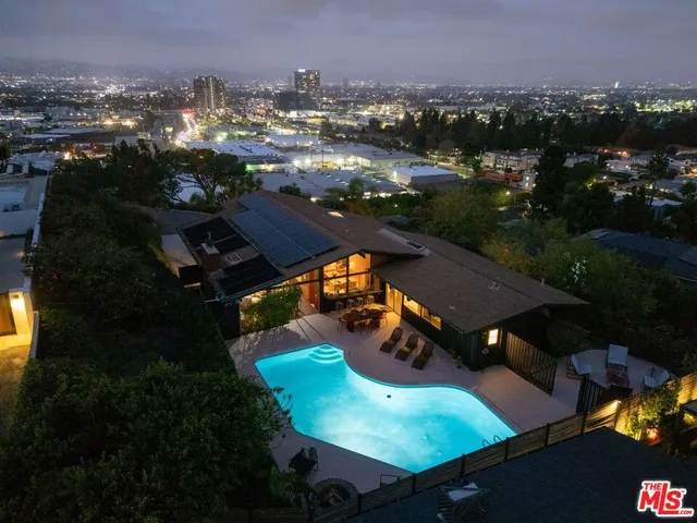an aerial view of a house with garden space
