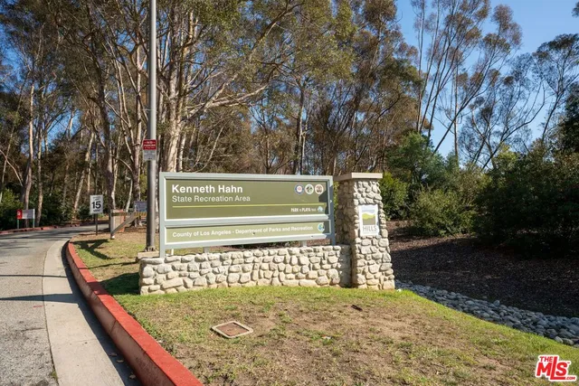 a view of a sign board with a park