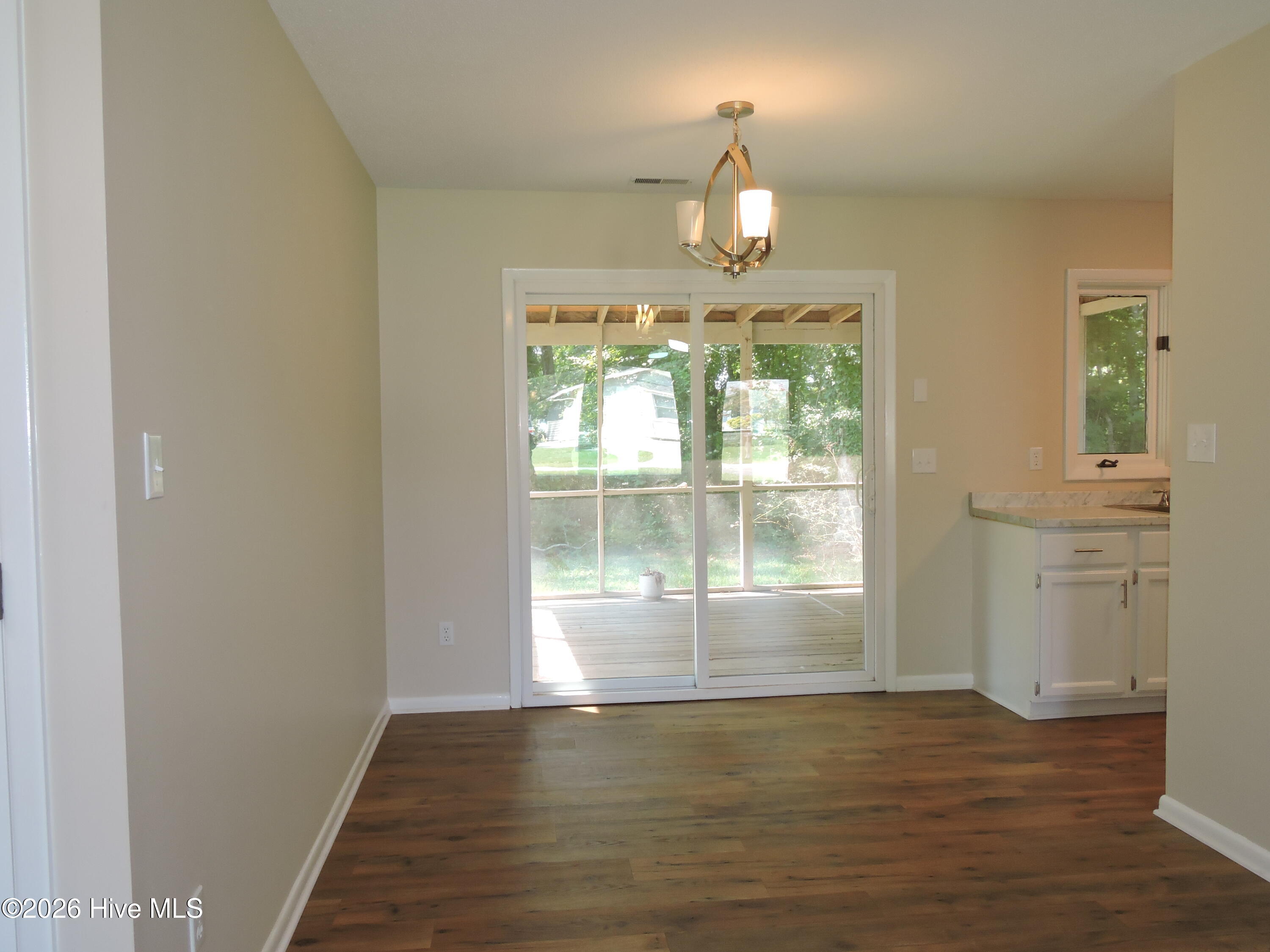 3211 Old Gate Road Morehead City, NC 28557 - Photo 13 of 25 Sliding glass doors to screened in deck