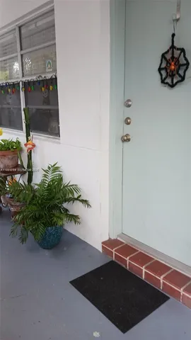a picture of a room with a potted plant