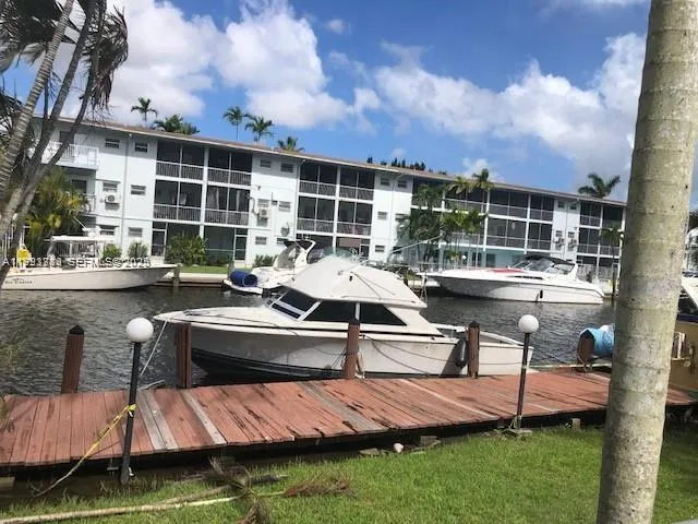 a view of swimming pool with outdoor seating
