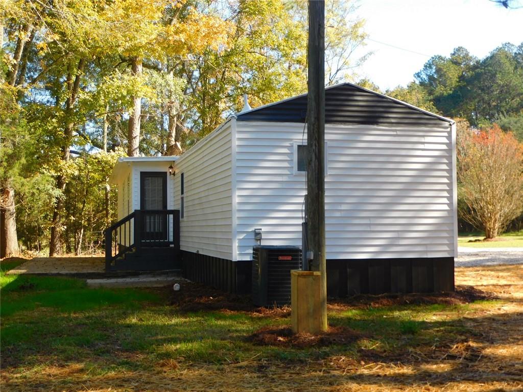 1101 Boswell Road Union Point, GA 30669 - Photo 13 of 60 a view of a house with backyard and garden