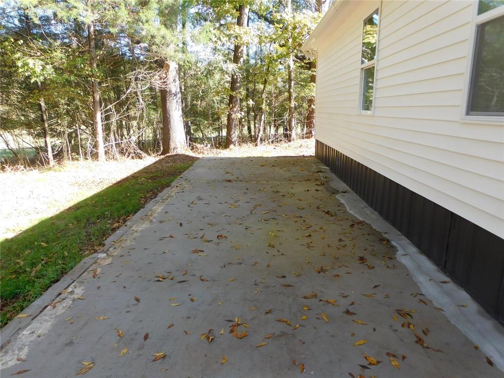 1101 Boswell Road Union Point, GA 30669 - Photo 19 of 60 a view of a yard with large trees