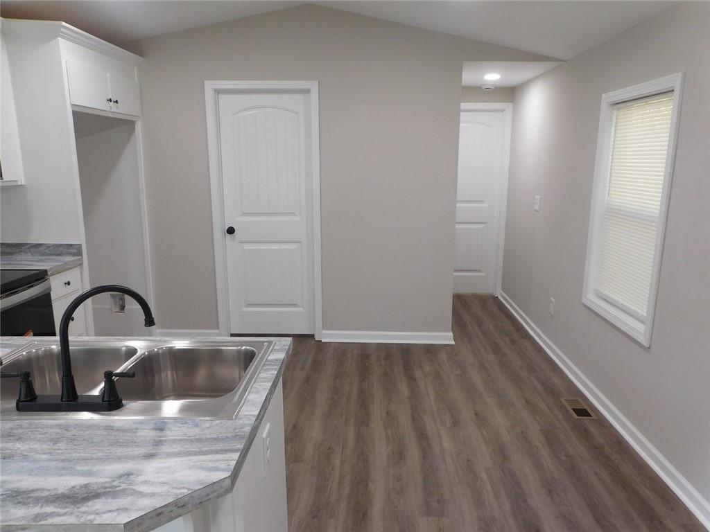 1101 Boswell Road Union Point, GA 30669 - Photo 37 of 60 a close view of a sink a faucet and appliance in the kitchen