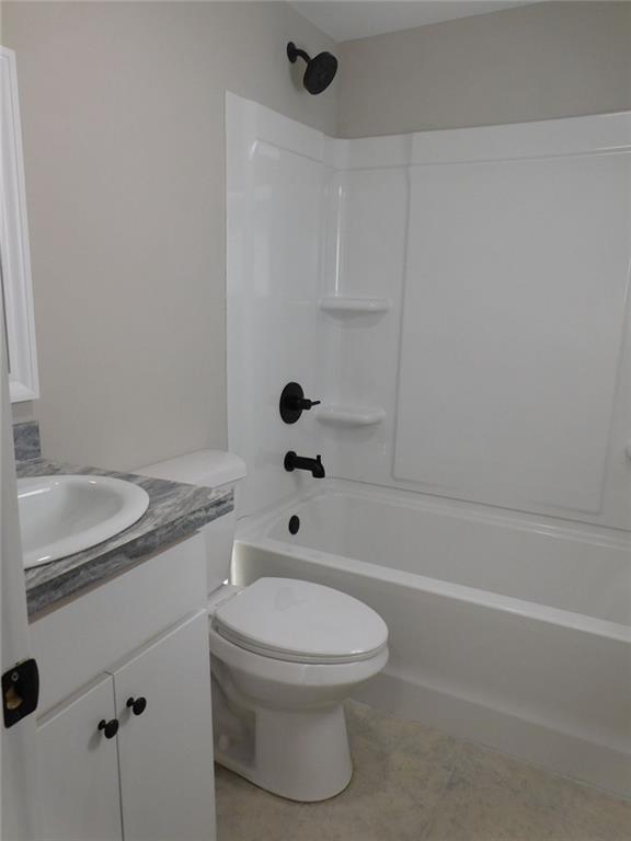 1101 Boswell Road Union Point, GA 30669 - Photo 48 of 60 a bathroom with a sink a toilet and shower