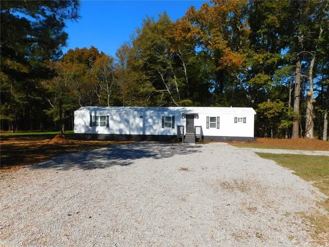 a view of street with large trees