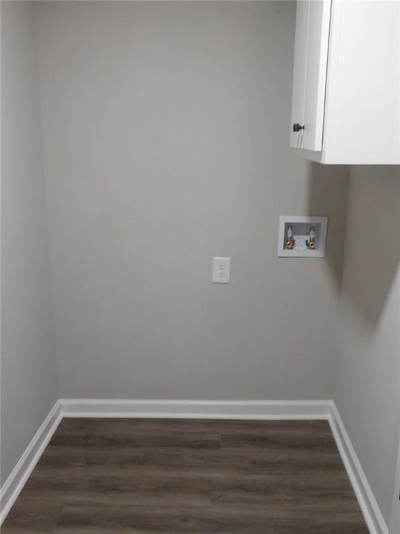 1101 Boswell Road Union Point, GA 30669 - Photo 51 of 60 a view of an empty room with wooden floor and a window