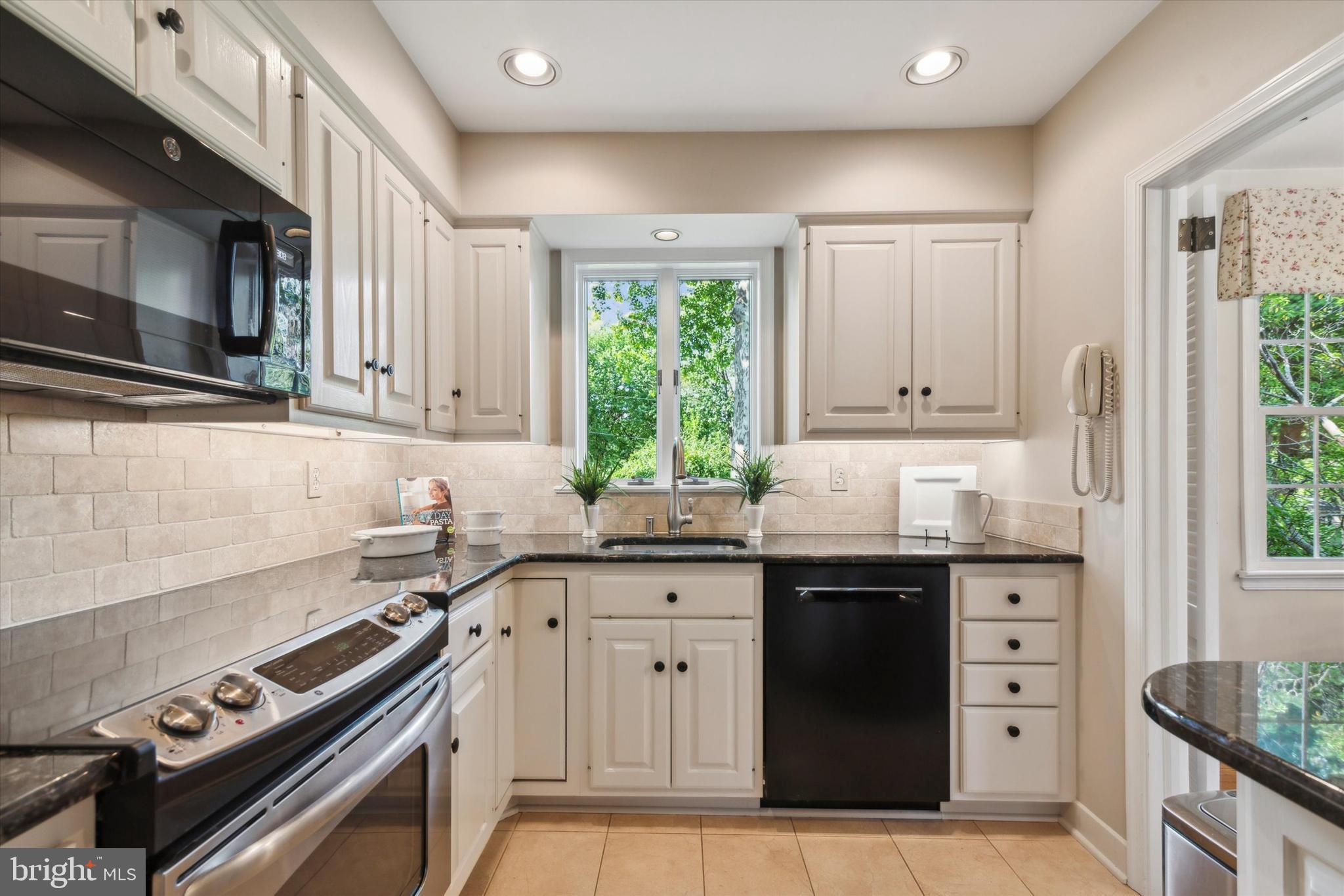 319 Landsende Road Devon, PA 19333 - Photo 10 of 27 Granite countertops, travertine backsplash