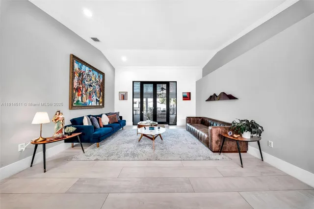 a living room with furniture and a couch