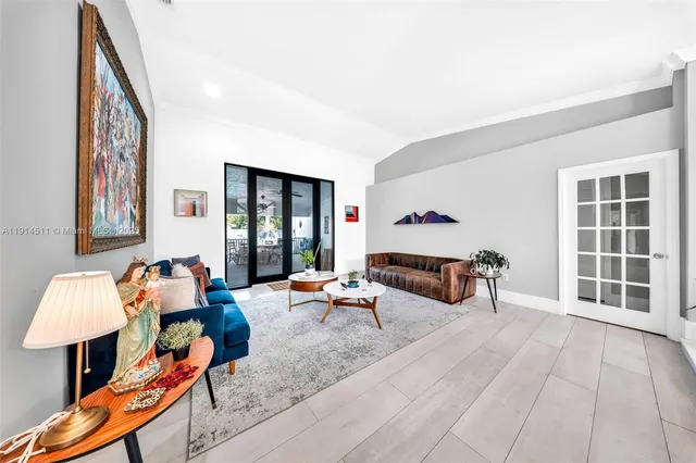 a spacious bedroom with a bed a couch and dresser