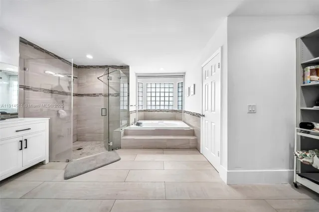 a bedroom with bed and a window