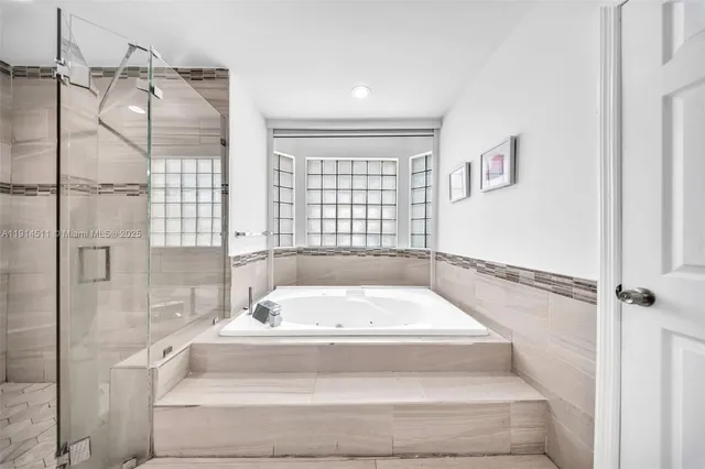 a living room with fireplace furniture and a flat screen tv