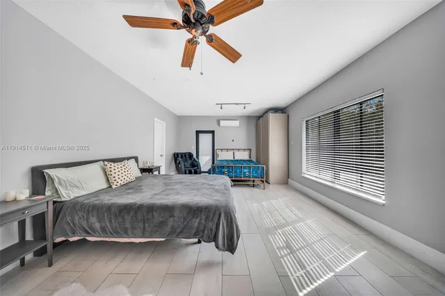 a living room with furniture and large windows