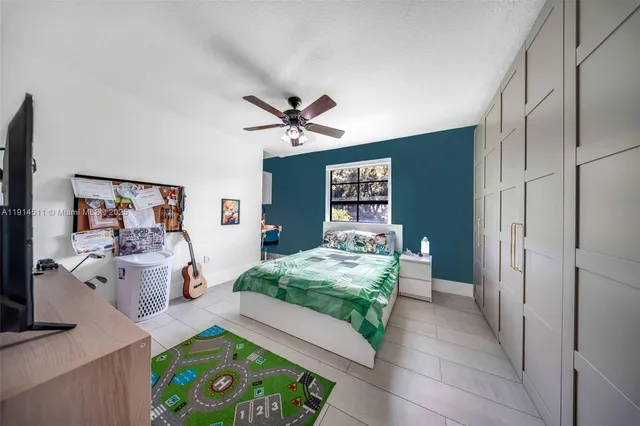 a view of a dining room with furniture water view and a floor to ceiling window