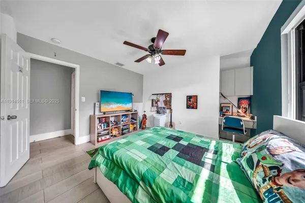 an aerial view of a house with garden space and lake view