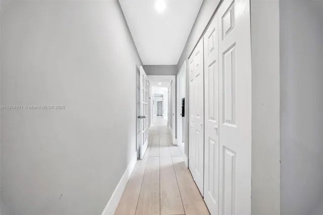 an aerial view of a house with garden space and lake view